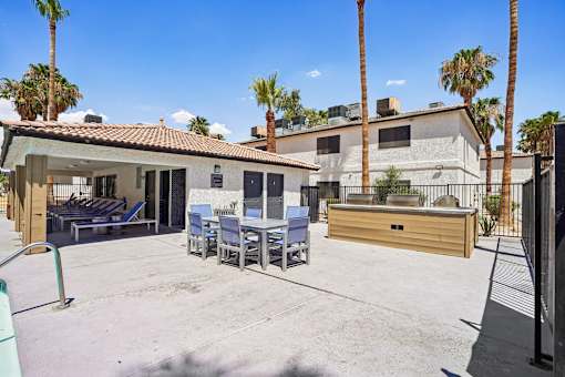 Outdoor courtyard with seating and hot tub at Dash Apartments, Las Vegas