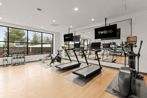 A gym with treadmills and other exercise equipment at Two 10 by Vintage, WA 98133