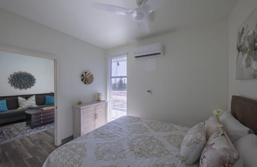 a bedroom with a bed and a ceiling fan at ROCKY HILL VETERANS HOUSING, California, 95688