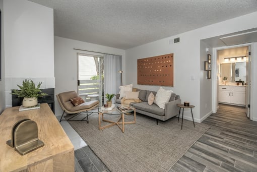 Apartments in Citurs Heights CA - The Arlo in Citrus Heights - Living Room with Wood-Style Flooring and Access to the Patio/Balcony
