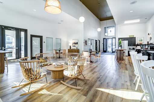 A modern living room with wooden floors and furniture.