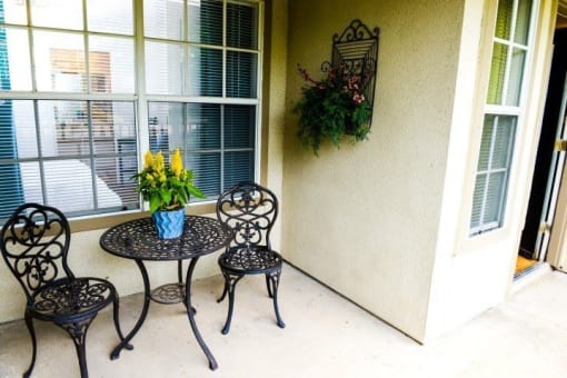 Patio with small table and chairs at ARBORS OF KILLEEN, KILLEEN, Texas