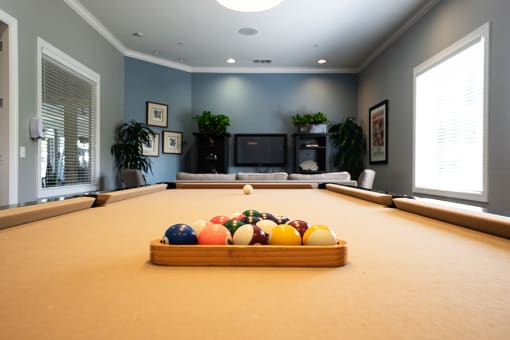 a game room with a pool table and