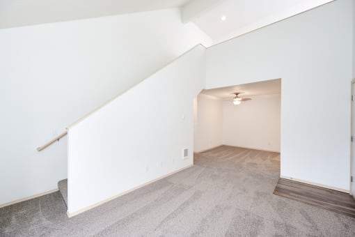 Townhome style layout with high ceilings and staircase leading upstairs at Devonwood and First Place Apartments, Battle Ground Washington