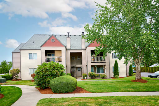 Building exteriors and lush landscaping at Devonwood and First Place Apartments, Battle Ground