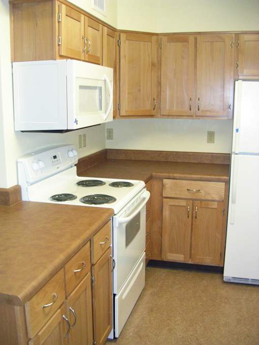 Kitchen With Cabinets at Bridge Meadows North Portland 55+, Portland