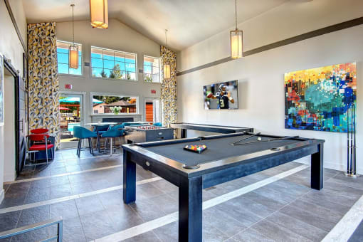 Clock Tower Village game room with pool table