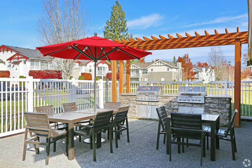 Clock Tower Village BBQ area with picnic table area