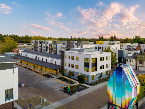 Upper Land Park, Sacramento, CA Apartments - Market Club At The Mill - Building Exterior With Street View Of Complex And View Of Sky