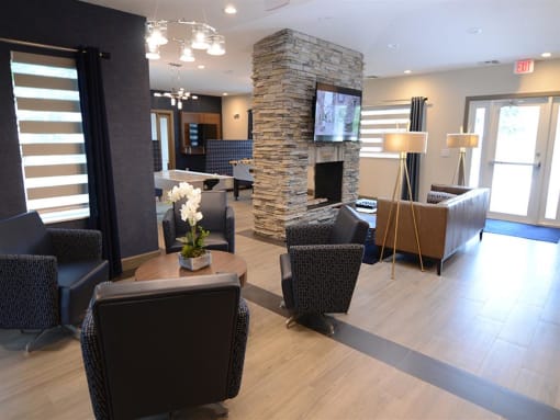 lounge area with seating and tv at The Edge at Town Center Apartments, Jacksonville, FL