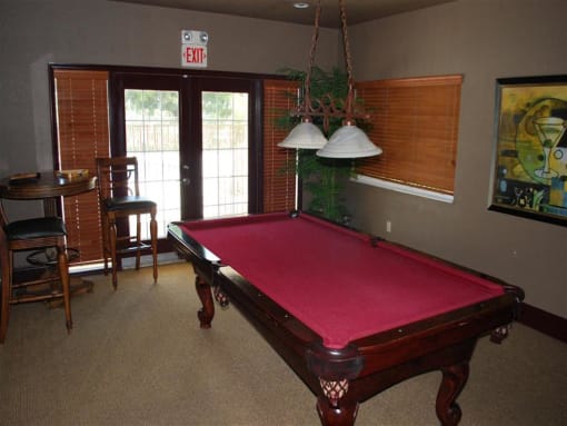 Pool table in center of room Eagles Pointe in Pompano Beach Florida