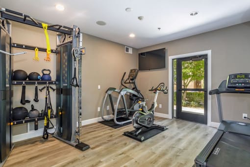Pet-Friendly Apartments in Elk Grove, CA- Castellino at Laguna West- Fully Equipped Gym with Wood Floors and Treadmill