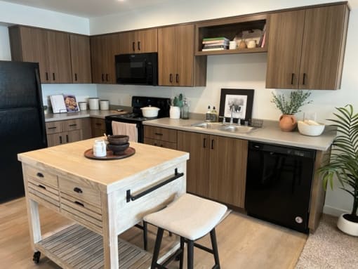 a small kitchen with a small island in the middle at FARM BY VINTAGE, MILL CREEK Washington
