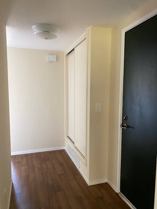 A white ceiling with a light switch and a smoke detector.at Via Casitas, California