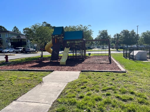 a playground with a slide and monkey bars at SUMMERBREEZE & SUMMERSET, Full State, 32086