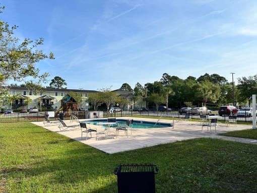 our apartments showcase an outdoor pool and hot tub at SUMMERBREEZE & SUMMERSET, Florida