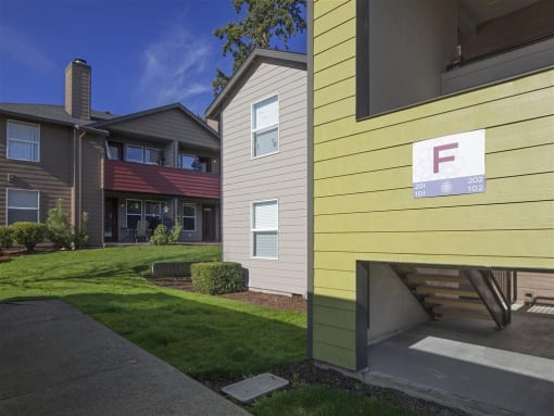Building Surrounded By Lush Landscaping with View of Outdoor Lounge at TOWNSHIP Apartments, CANBY, OR