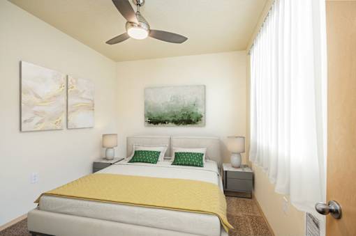 Bedroom With Ceiling Fan at Fairview Village Homes, Fairview, OR