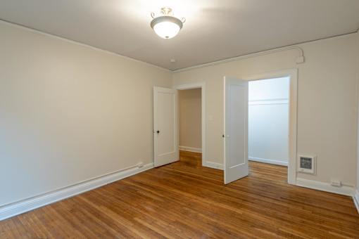 A room with wooden floors and white walls.at Palladian Apartments, Portland ? 