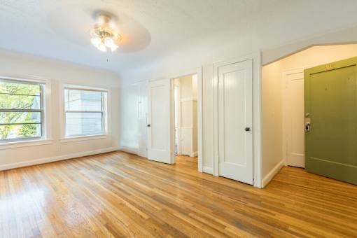 A room with wooden floors and white walls.at Palladian Apartments, Portland, OR ? 