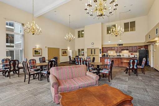 A living room with a couch, chairs, and a coffee table at Vintage at Burien, Burien,Washington.