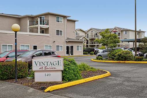 A sign for Vintage at Burien is in front of a building at Vintage at Burien,Burien,WA