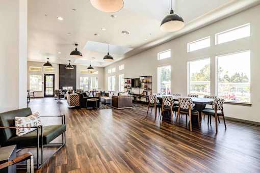 A spacious room with wooden floors and furniture at View by Vintage Apartments, Bonney Lake