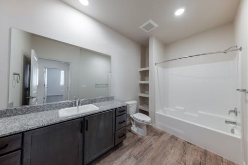 the renovated bathroom in a new home with a shower toilet and sink at Springview by Vintage, Nevada