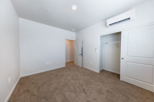 a room with carpet and white walls and a closet at Springview by Vintage, NV, 89512