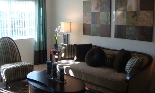 Living room with window at Carolina Club Apartments, Daytona Beach, FL, 32114