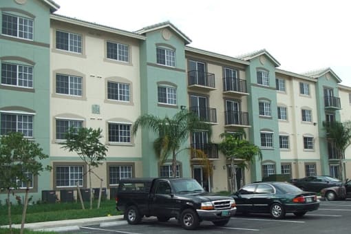 Exterior view of building with parking at Harbour Cove, Hallandale Beach, FL 33009