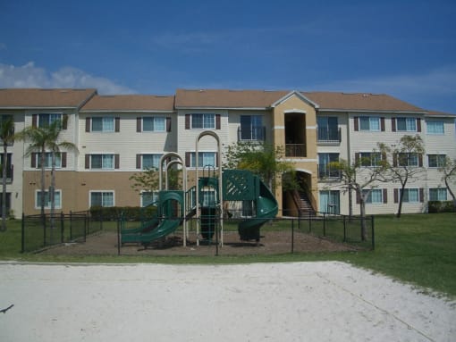 Playground near building at Hawk's Landing Apartments, Fort Myers