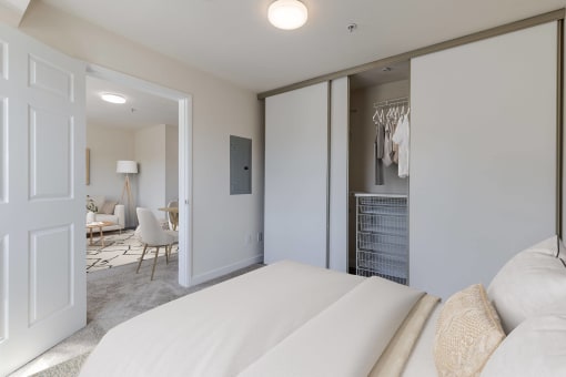 a bedroom with a large bed and a closet
