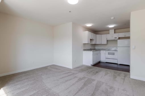 a white kitchen with white appliances and white cabinets