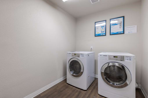 a laundry room with a washing machine and a dryer