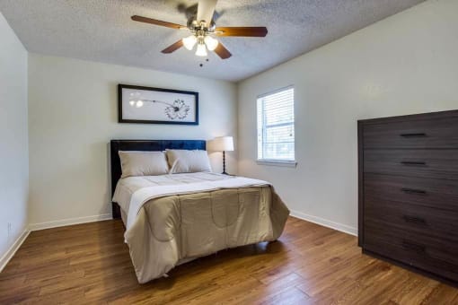bedroom with a bed and a ceiling fan at THE EASTWOOD, AUSTIN, TX 78705