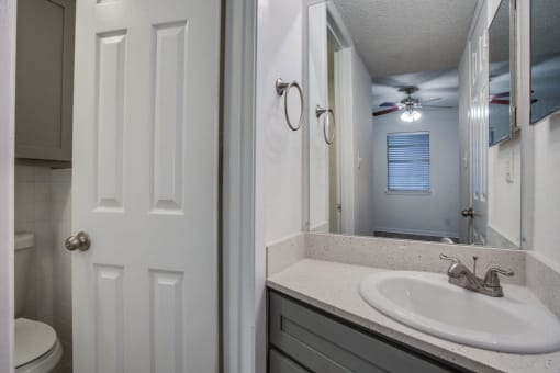 bathroom with a sink and a toilet at THE EASTWOOD, Texas, 78705