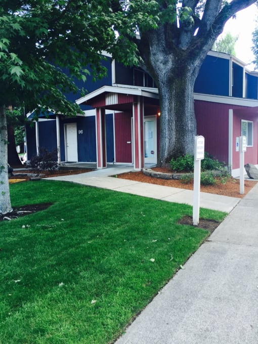 a sidewalk in front of a house with a tree in the yard at Fort Vancouver Terrace, Vancouver, WA, 98661