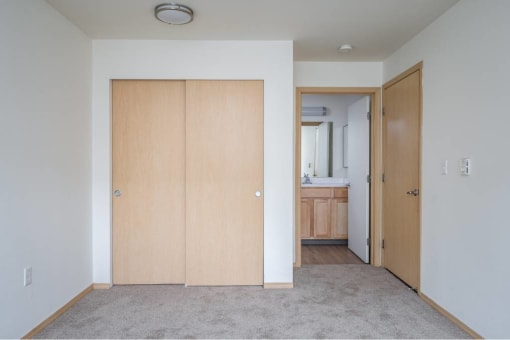 an empty room with white walls and a wood floor  at Fort Vancouver Terrace, Washington