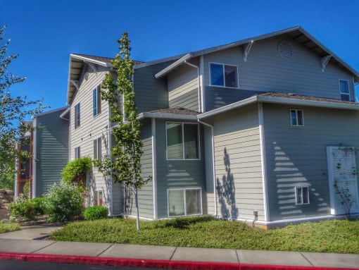 a blue house with a sidewalk in front of it at Troutdale Terrace, Oregon