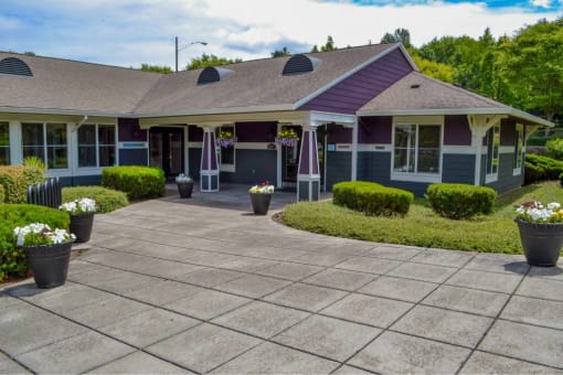 the front of a house with a driveway and flower pots at Troutdale Terrace, Troutdale,  97060