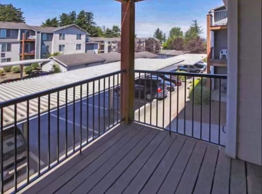 a balcony with a view of a pool and a house at Troutdale Terrace, Troutdale,  97060