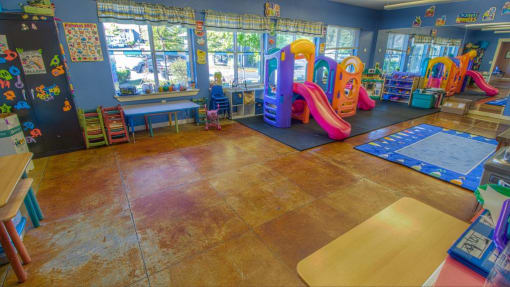 a children play room with slides and other toys at Troutdale Terrace, Oregon 97060