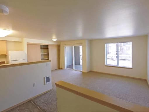 an empty living room and kitchen with a window at Troutdale Terrace, Troutdale,  97060