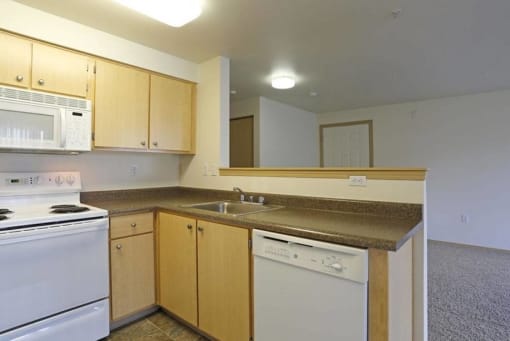 a kitchen with cabinet at Troutdale Terrace, Oregon 97060