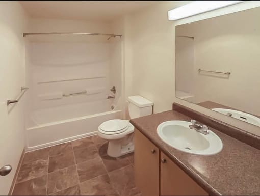 a bathroom with a sink and a toilet and a bath tub at Troutdale Terrace, Oregon