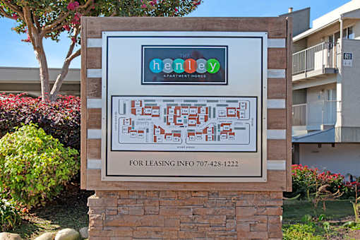 A sign for Herley Apartments with a phone number for leasing at The Henley Apartments, Suisun City