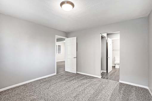 A room with a carpeted floor and a ceiling light at The Henley Apartments, California, 94585