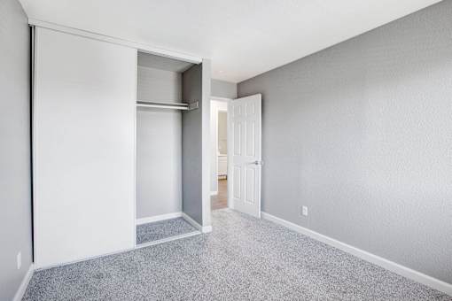 A room with a white door and a white wall at The Henley Apartments, Suisun City