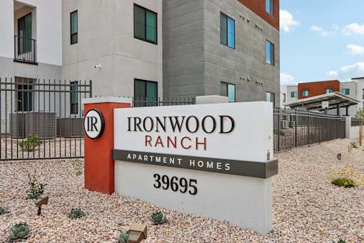 A sign for Ironwood Ranch Apartment Homes stands in front of a building at Ironwood Ranch Apartments,Maricopa,AZ